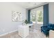 Home office with gray walls, natural light, white desk, and blue accent chair at 3062 Cambridge Mill St, Acworth, GA 30102