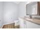 Well-lit powder room featuring modern vanity and fixtures, plus neutral decor at 3826 Baxley Village Trl, Suwanee, GA 30024