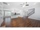 Spacious living area with hardwood floors, open concept kitchen, and staircase at 3826 Baxley Village Trl, Suwanee, GA 30024