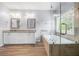 Luxurious primary bathroom with double vanity, soaking tub, and glass-enclosed shower at 3826 Baxley Village Trl, Suwanee, GA 30024