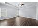 Large main bedroom with tray ceiling, bright natural light, and hard wood floors at 3826 Baxley Village Trl, Suwanee, GA 30024