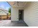 Covered patio featuring an outdoor ceiling fan and convenient access door, great for outdoor relaxation at 3826 Baxley Village Trl, Suwanee, GA 30024