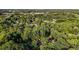 Aerial view of house in wooded neighborhood with nearby shopping and restaurants at 4353 White Oak Dr, Sugar Hill, GA 30518