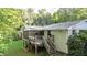 Outdoor deck with stairs leading to the backyard with a screened-in porch at 4353 White Oak Dr, Sugar Hill, GA 30518
