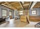 An unfinished basement provides ample storage and features visible ceiling beams at 4353 White Oak Dr, Sugar Hill, GA 30518