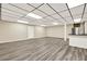 Spacious basement with recessed lighting and modern flooring, perfect for entertaining at 4353 White Oak Dr, Sugar Hill, GA 30518