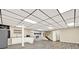 Finished basement with kitchenette, fireplace, and modern drop ceiling with recessed lighting at 4353 White Oak Dr, Sugar Hill, GA 30518