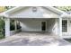 Spacious covered carport with brick accents and a rear entrance at 4353 White Oak Dr, Sugar Hill, GA 30518