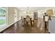Open dining area with hardwood floors, natural light, and connection to the kitchen at 4353 White Oak Dr, Sugar Hill, GA 30518