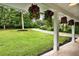 Large front yard with a large driveway and hanging flower baskets on the porch at 4353 White Oak Dr, Sugar Hill, GA 30518