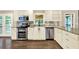 Charming kitchen featuring stainless steel appliances and granite countertops at 4353 White Oak Dr, Sugar Hill, GA 30518