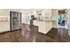 Modern kitchen featuring stainless steel appliances, granite countertops, and white cabinetry at 4353 White Oak Dr, Sugar Hill, GA 30518