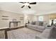 Comfortable living room featuring a plush sofa, stylish rug, and elegant decor at 4353 White Oak Dr, Sugar Hill, GA 30518