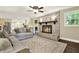 Inviting living room showcasing an open layout connecting to the gourmet kitchen at 4353 White Oak Dr, Sugar Hill, GA 30518