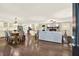 Open-concept living space features a seamlessly blending kitchen and living room with plenty of natural light at 4353 White Oak Dr, Sugar Hill, GA 30518