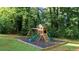 Playground in the backyard for with mulch on the ground at 4353 White Oak Dr, Sugar Hill, GA 30518