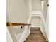 Traditional wooden staircase featuring a light-colored banister at 4353 White Oak Dr, Sugar Hill, GA 30518