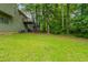 Lush backyard with tall trees offering privacy and shade, creating a serene outdoor retreat at 6015 Sumit Nw Ct, Kennesaw, GA 30152