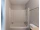 Standard bathroom featuring a shower-tub combo with a white surround and essential fixtures at 6015 Sumit Nw Ct, Kennesaw, GA 30152