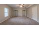 Bright bedroom with two closets, a window, plush carpet and a door at 6015 Sumit Nw Ct, Kennesaw, GA 30152