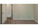 Bedroom with carpet flooring and neutral-colored walls with a view to another room at 6015 Sumit Nw Ct, Kennesaw, GA 30152