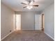 Spacious bedroom featuring a ceiling fan and multiple entrances at 6015 Sumit Nw Ct, Kennesaw, GA 30152