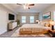 Staged bedroom with modern furniture, decor, and a cozy rug for added style and comfort at 6015 Sumit Nw Ct, Kennesaw, GA 30152