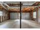 Spacious unfinished garage with exposed ceiling and structural elements, offering ample parking space at 6015 Sumit Nw Ct, Kennesaw, GA 30152