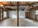 Unfinished garage with a concrete floor and exposed ceiling structures awaiting customization at 6015 Sumit Nw Ct, Kennesaw, GA 30152