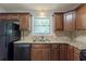 Kitchen featuring wood cabinets, granite countertops, and stainless steel appliances at 6015 Sumit Nw Ct, Kennesaw, GA 30152