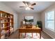 Bright office space featuring a desk and a bookcase at 6015 Sumit Nw Ct, Kennesaw, GA 30152