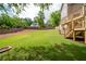 Lush backyard with stairs leading to the deck; an ideal outdoor retreat overlooking the private, green space at 101 Misty Valley Dr, Canton, GA 30114