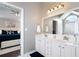 Main bathroom with double vanity, soaking tub, and entry to main bedroom at 101 Misty Valley Dr, Canton, GA 30114
