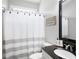 Well-lit bathroom with white vanity and decorative shower curtain at 101 Misty Valley Dr, Canton, GA 30114