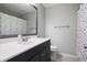 Bathroom with a vanity and mirror, a toilet, and a shower with a colorful curtain at 101 Misty Valley Dr, Canton, GA 30114