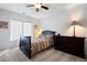 Cozy bedroom with a large window, carpet floors, ceiling fan, and a dresser at 101 Misty Valley Dr, Canton, GA 30114