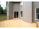 Wooden deck providing an outdoor living space, perfect for relaxing or entertaining, with access to the backyard at 101 Misty Valley Dr, Canton, GA 30114