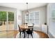 Eat-in kitchen nook with sliding door to deck and wood flooring at 101 Misty Valley Dr, Canton, GA 30114