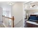 Upstairs hallway leading into main bedroom with hardwood floors and vaulted ceiling at 101 Misty Valley Dr, Canton, GA 30114