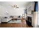 Bright living room featuring a fireplace, hardwood floors, and modern decor at 101 Misty Valley Dr, Canton, GA 30114