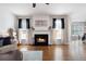 Bright living room featuring a fireplace, hardwood floors, and modern decor at 101 Misty Valley Dr, Canton, GA 30114