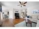 Bright living room with hardwood floors, ceiling fan, and modern decor at 101 Misty Valley Dr, Canton, GA 30114