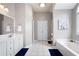 Bright and spacious main bathroom featuring a soaking tub, double vanity, and storage at 101 Misty Valley Dr, Canton, GA 30114
