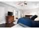 Comfortable main bedroom featuring hardwood floors, a dresser, and access to main bathroom at 101 Misty Valley Dr, Canton, GA 30114