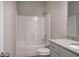 Clean bathroom with a tub/shower combo, toilet, and granite-topped vanity at 200 Eva Way Ne, Cartersville, GA 30121