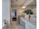 Bright bathroom featuring double vanity with granite countertop and a soaking tub at 200 Eva Way Ne, Cartersville, GA 30121