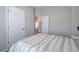 Cozy bedroom with neutral walls, patterned bedding, and access to an adjoining room at 200 Eva Way Ne, Cartersville, GA 30121
