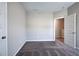 Spacious bedroom with gray carpet, white walls, and an adjoining room doorway at 200 Eva Way Ne, Cartersville, GA 30121