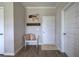 Inviting entryway featuring coat rack, bench with pillows, and neutral paint at 200 Eva Way Ne, Cartersville, GA 30121