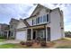 Charming two-story home with stone accents, a covered porch, and an attached garage at 200 Eva Way Ne, Cartersville, GA 30121